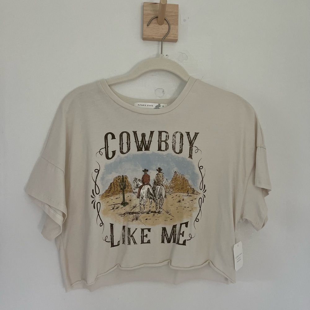 Cropped “Cowboy Like Me” Taylor Swift tee from Altar’d State